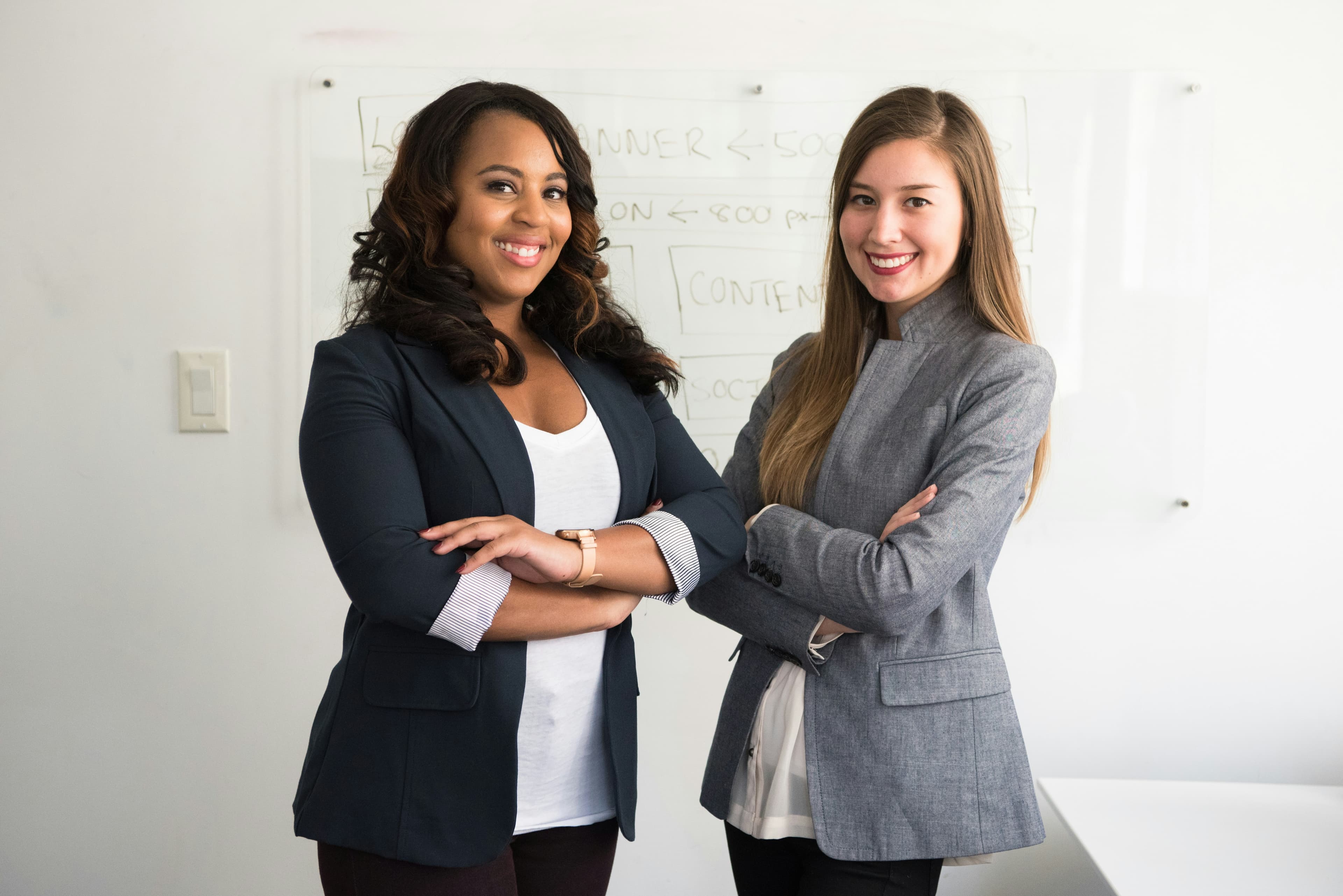 Two professional women representing technical leadership